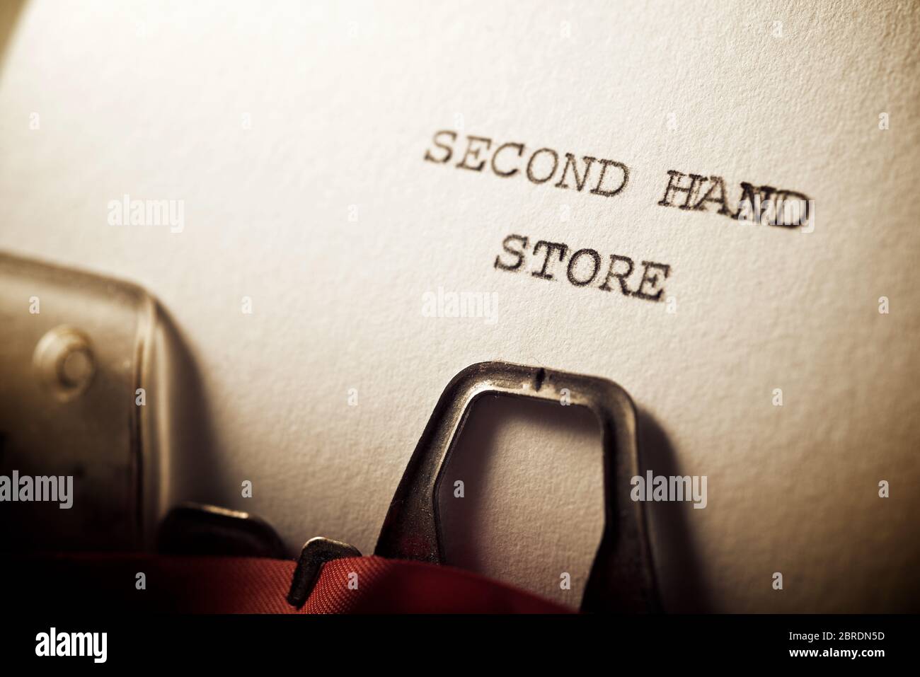 Second hand store written with a typewriter Stock Photo - Alamy