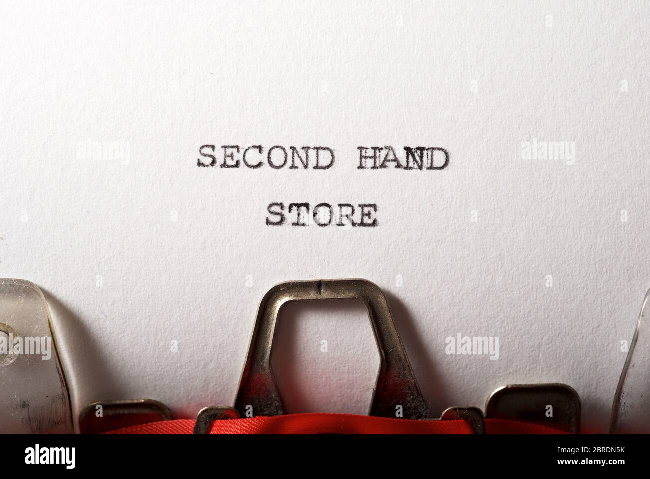 Second hand store written with a typewriter Stock Photo - Alamy