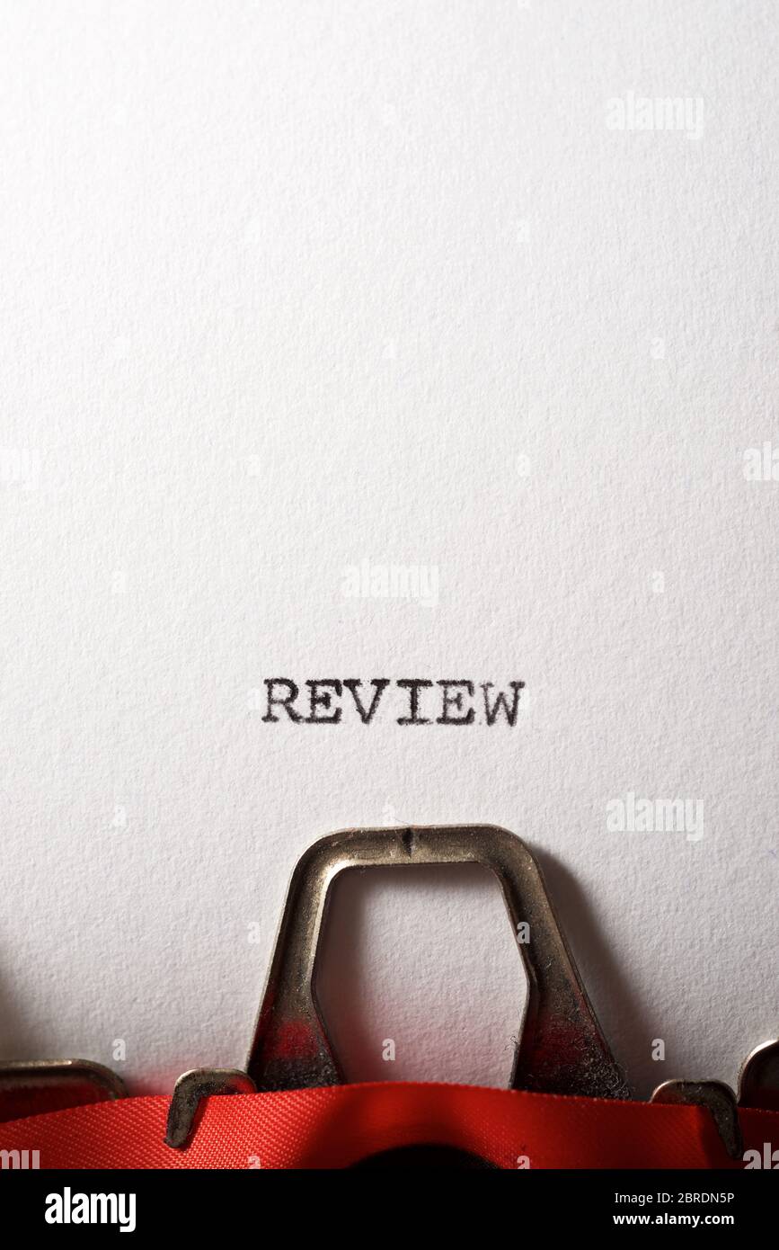 Review word written with a typewriter. Stock Photo
