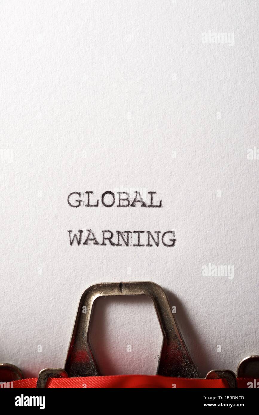 Global warning text written with a typewriter. Stock Photo