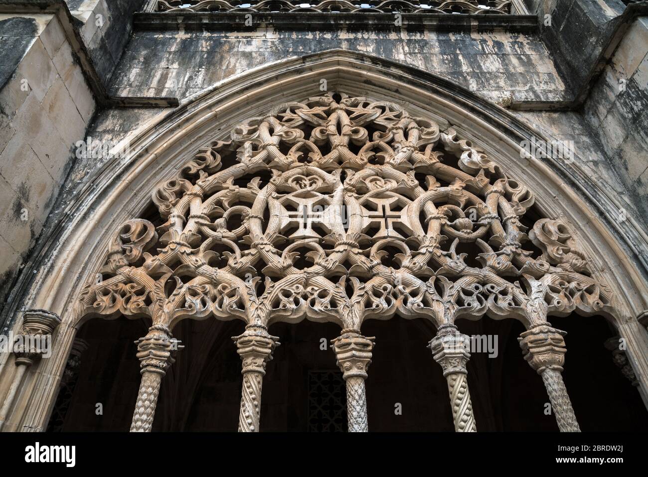 Colonettes, supporting intricate arcade screens in Royal Cloister at the Monastery of Saint Mary of the Victory in Batalha, Portugal Stock Photo