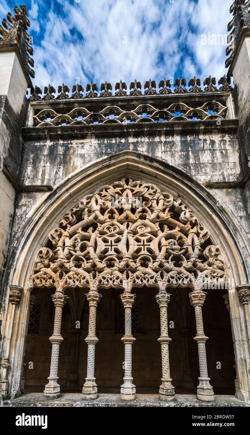 Colonettes, supporting intricate arcade screens in Royal Cloister at the Monastery of Saint Mary of the Victory in Batalha, Portugal Stock Photo