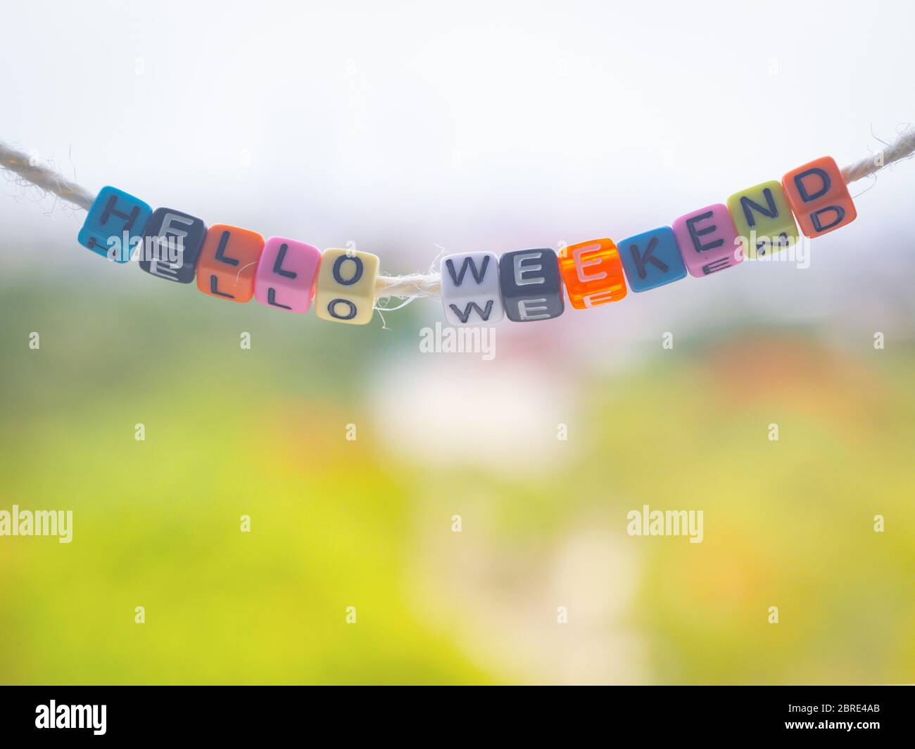 Hello weekend word written on color blocks, concept Stock Photo - Alamy