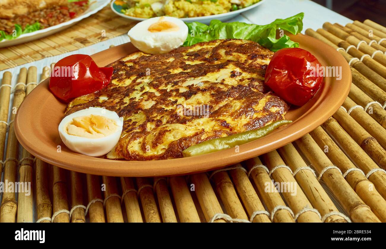 Salt cod tortilla omelet fish with potatoes Stock Photo Alamy