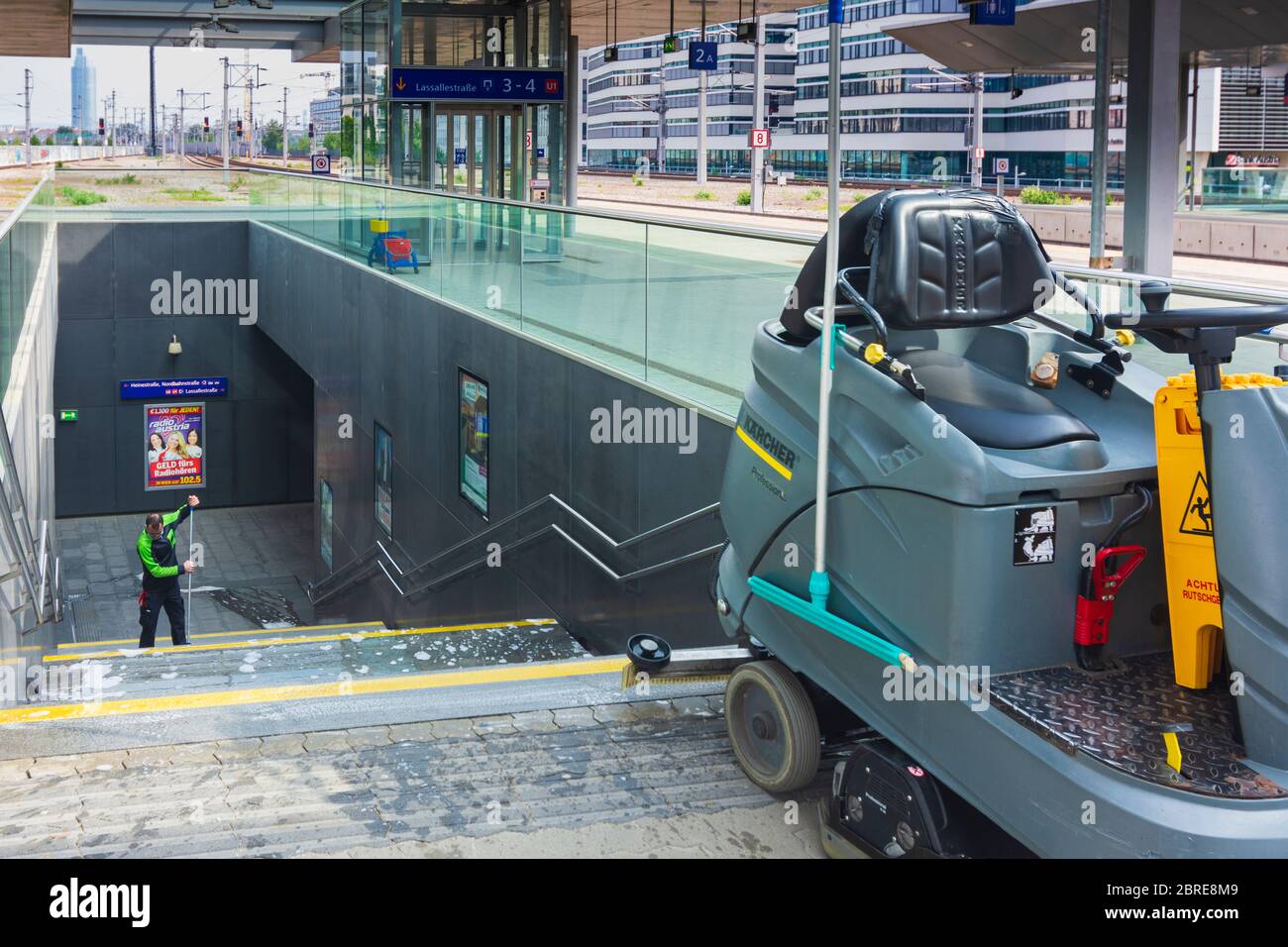 Wien, Vienna cleaner cleaning staircase at railway station Praterstern