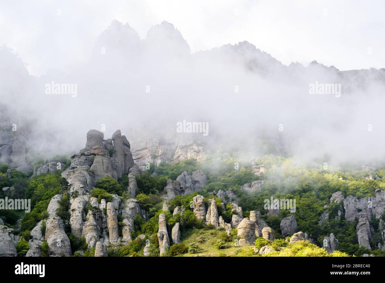 Valley of Ghosts of misty Demerdji mountain, Crimea, Russia. This place is a natural landmark of Crimea. Scenic view of bizarre rocks on the Southern Stock Photo