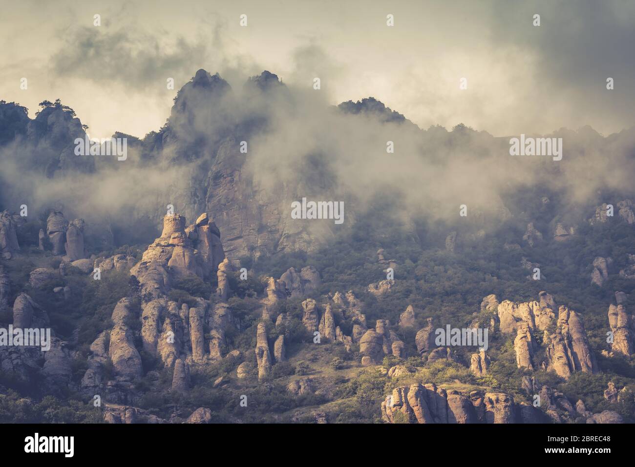 The Demerdji mountain with low lying clouds, Crimea, Russia. Valley of Ghosts. Stock Photo