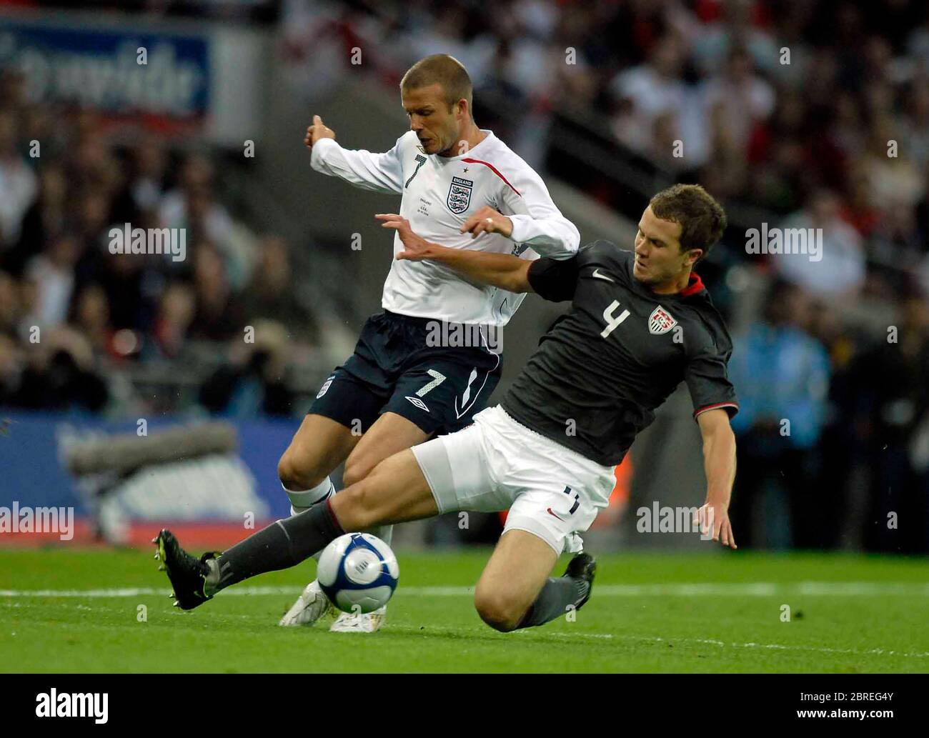 LONDON, UK. MAY 28: David Beckham (England) tries to get past Michael Bradley (USA, 4). during International Friendly between England and USA at Wembl Stock Photo