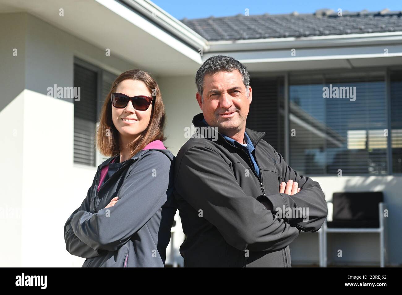 Proud Couple Age 35 45 In Winter Clothing Standing In Front Of New Home Buy Sell Real Estate Property Home Insurance Mortgage Bank Loans And Stock Photo Alamy Proud Couple Age 35 45 In Winter Clothing Standing In Front Of New Home Buy Sell Real Estate Property Home Insurance Mortgage Bank Loans And Stock Photo Alamy