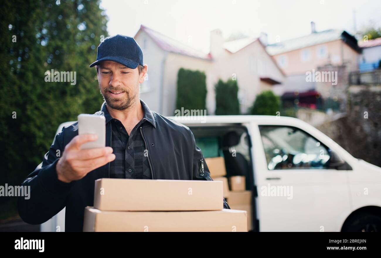 Delivery Man Using Remote Delivery man in uniform using hi-res stock photography and images - Alamy