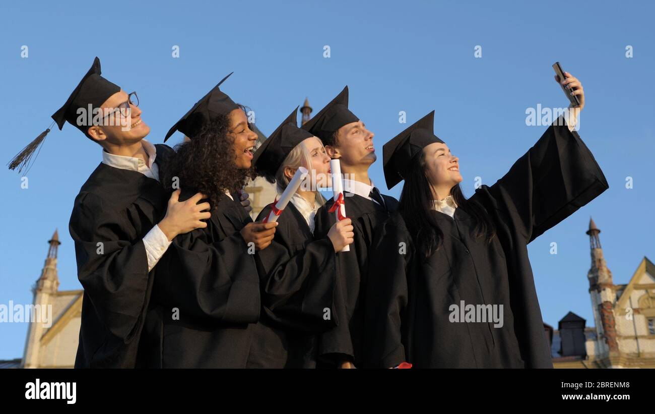 A group of multiethnic graduate students making selfie. Stock Photo