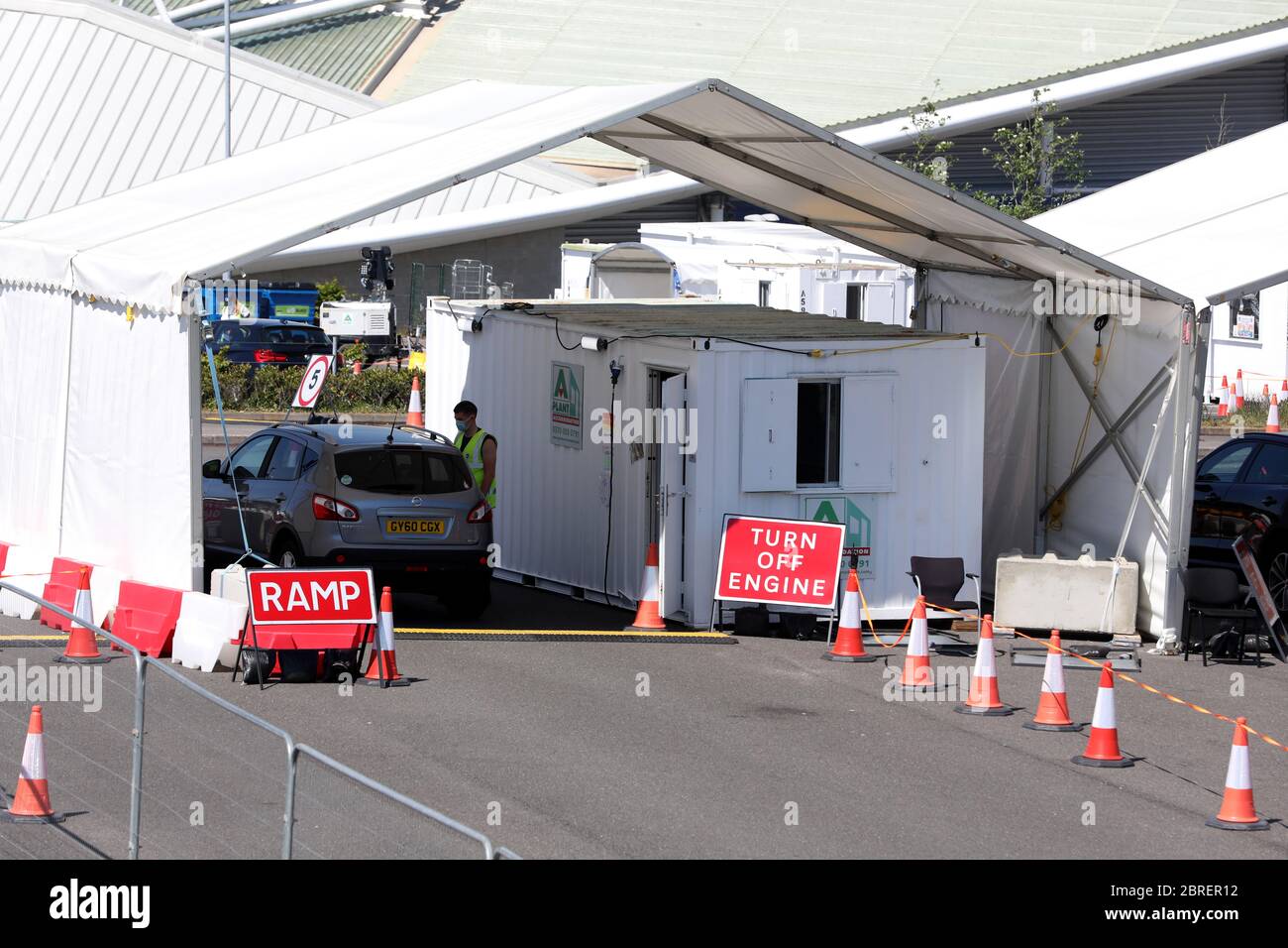 Brighton, East Sussex, UK - Coronavirus (Covid-19) testing centre at Brighton AMEX Football ground is very quiet with only three cars going through and staff waiting in the sunshine. Thursday 21st May 2020 © Sam Stephenson / Alamy Live News. Stock Photo