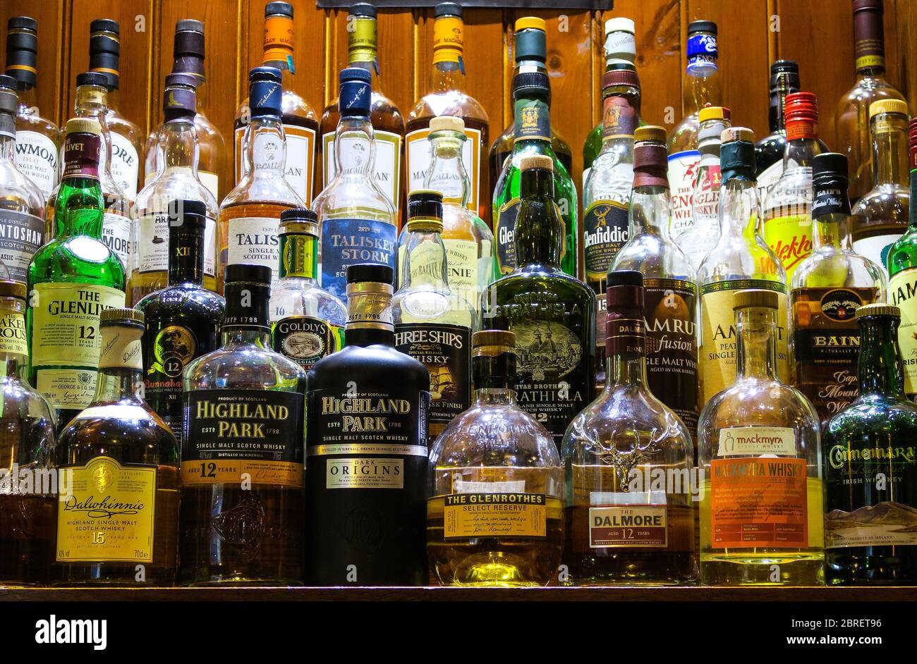 Various bottles of Whisky for sale in a pub. Stock Photo