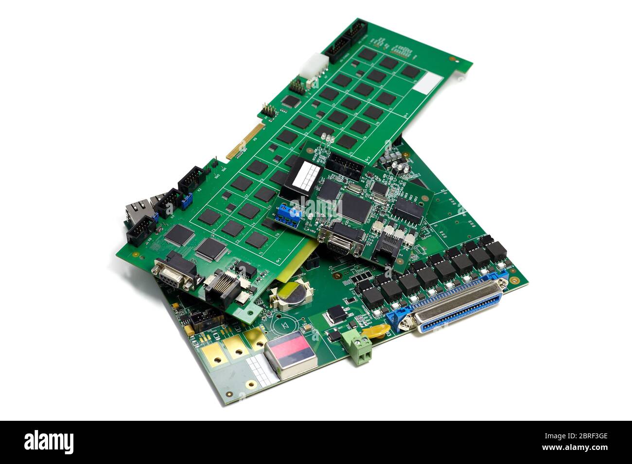 Set of electronic printed circuit boards with microchips and other components, angled view, isolated on white Stock Photo