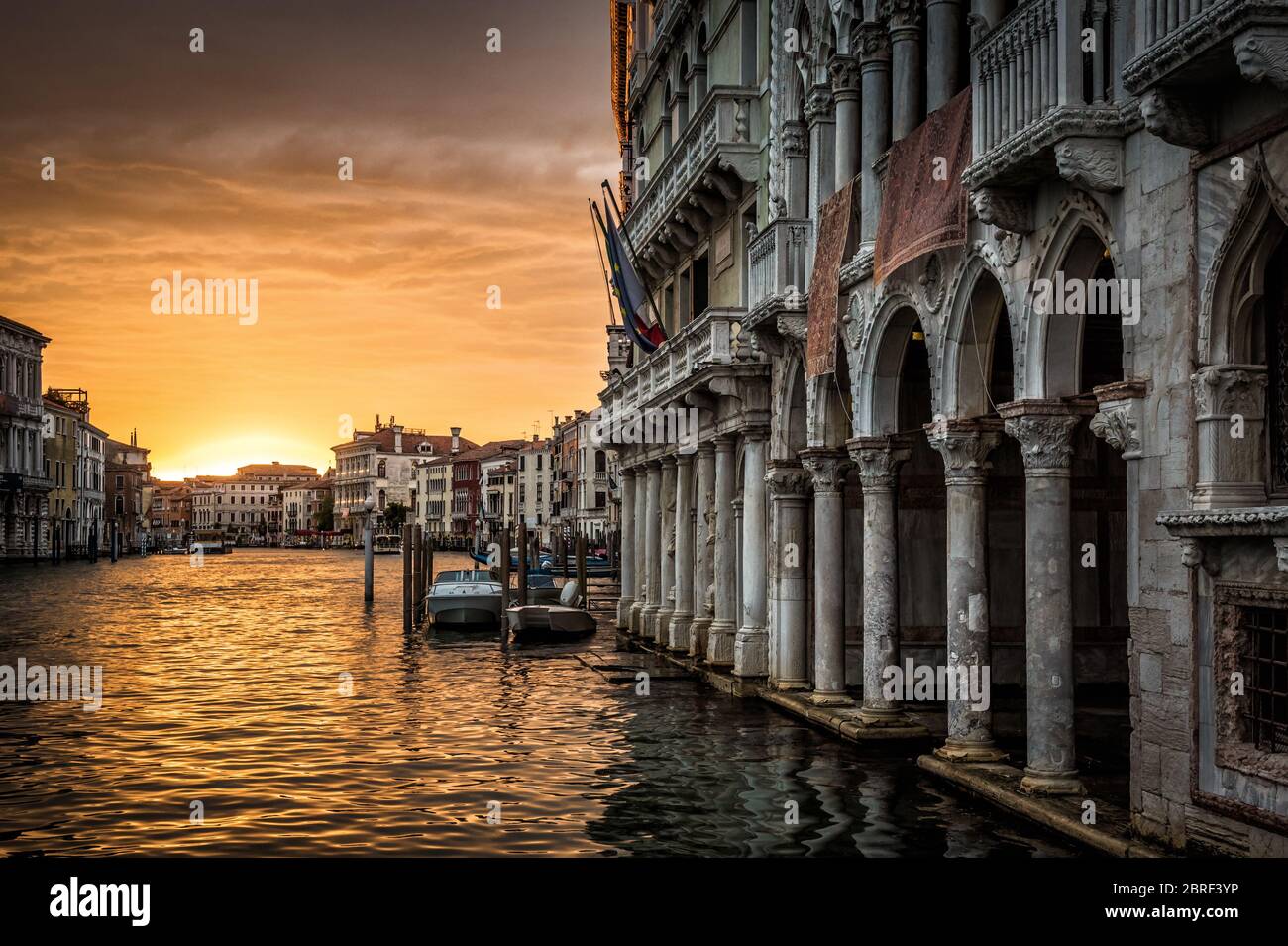 Grand Canal with Ca' d'Oro palace at sunset in Venice, Italy. Ca' d'Oro (Palazzo Santa Sofia) is one of the older palaces in Venice. Stock Photo