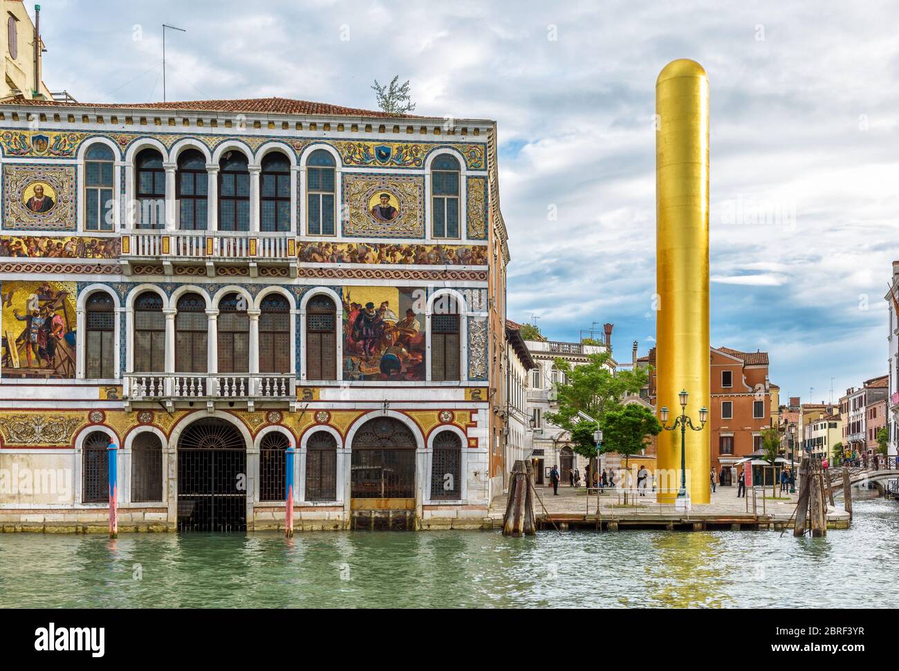 Venice, Italy - May 20, 2017: Golden Tower by James Lee Byers at the beautiful palace on Grand Canal in Venice. Panorama of the old and new architectu Stock Photo