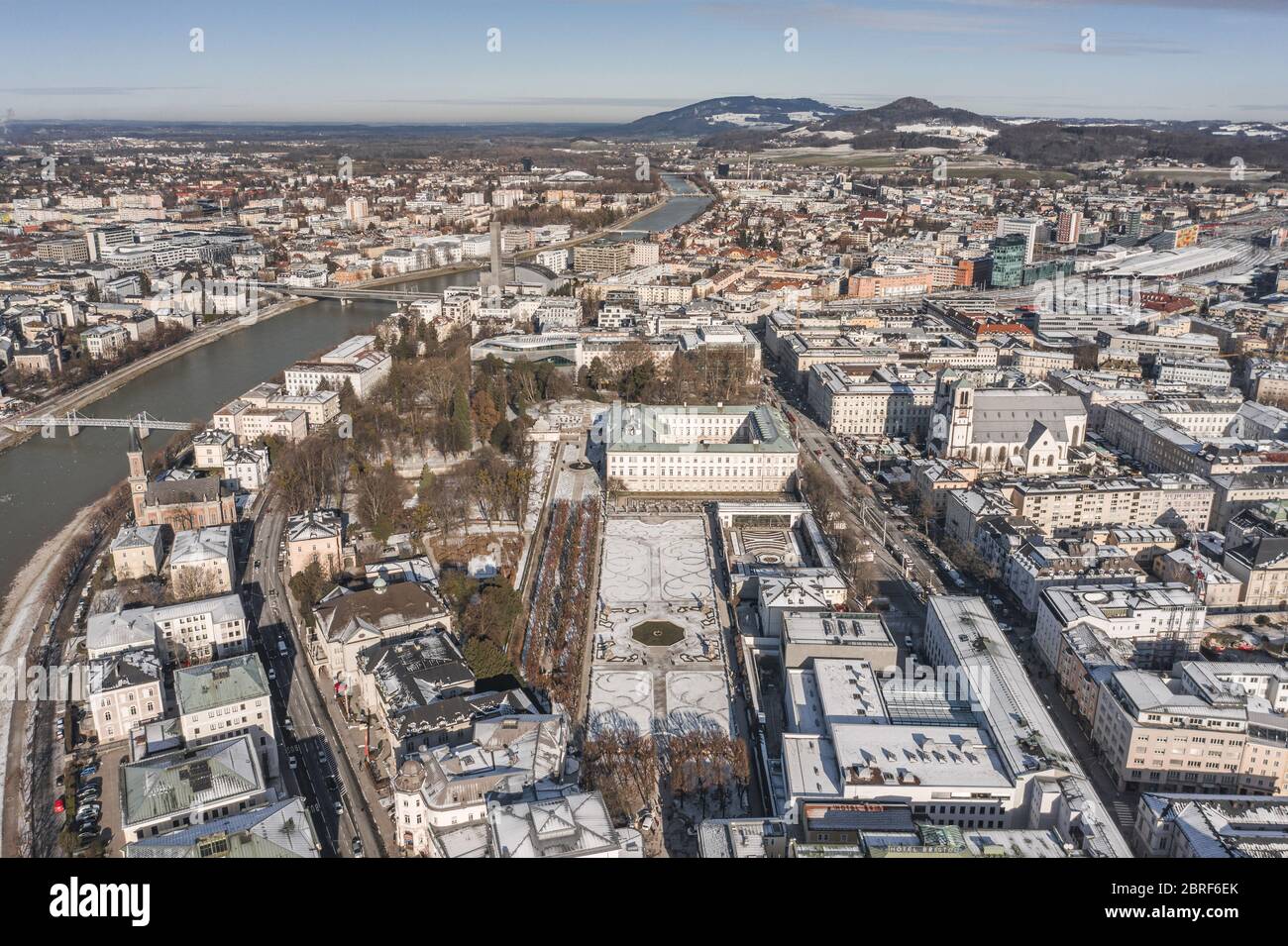 Aerial drone view of snowy Mirabelle Palace in Salzburg downtown center in winter morning Stock Photo