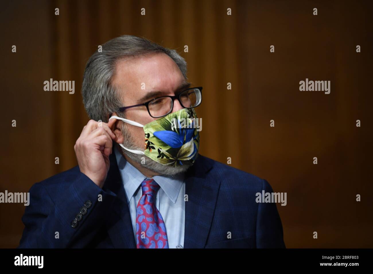 Andrew Wheeler, Administrator, United States Environmental Protection Agency (EPA) adjusts his mask at a hearing titled 'Oversight of the Environmental Protection Agency' in the Dirksen Senate Office Building on Wednesday, May 20, 2020 in Washington, DC. Wheeler will be asked about the rollback of regulations by the Environment Protection Agency since the pandemic started in March. Credit: Kevin Dietsch/Pool via CNP /MediaPunch Stock Photo