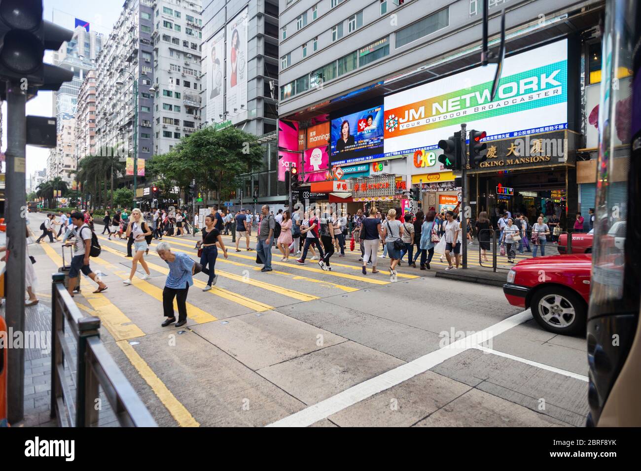 Hong Kong, Hong Kong - September, 26, 2017: People cross the road on zebra in the street of Hong Kong Stock Photo