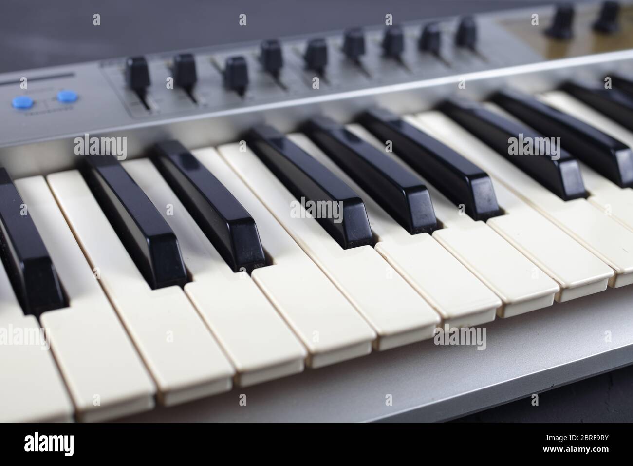 musical midi keyboard stands on a table Stock Photo Alamy