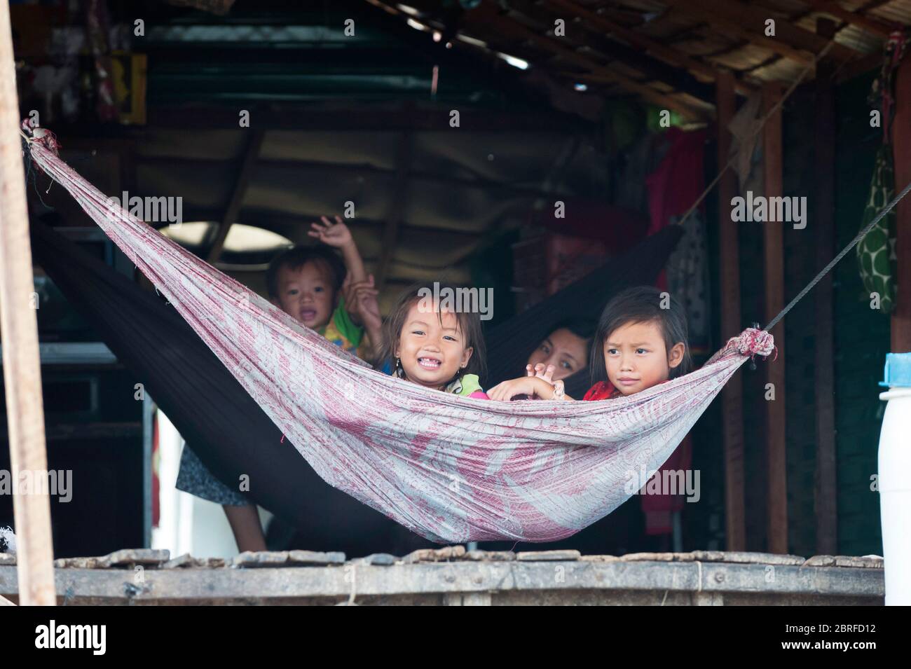 Smiling children at Kompong Luong floating Village. Krakor, Cambodia, Southeast Asia Stock Photo