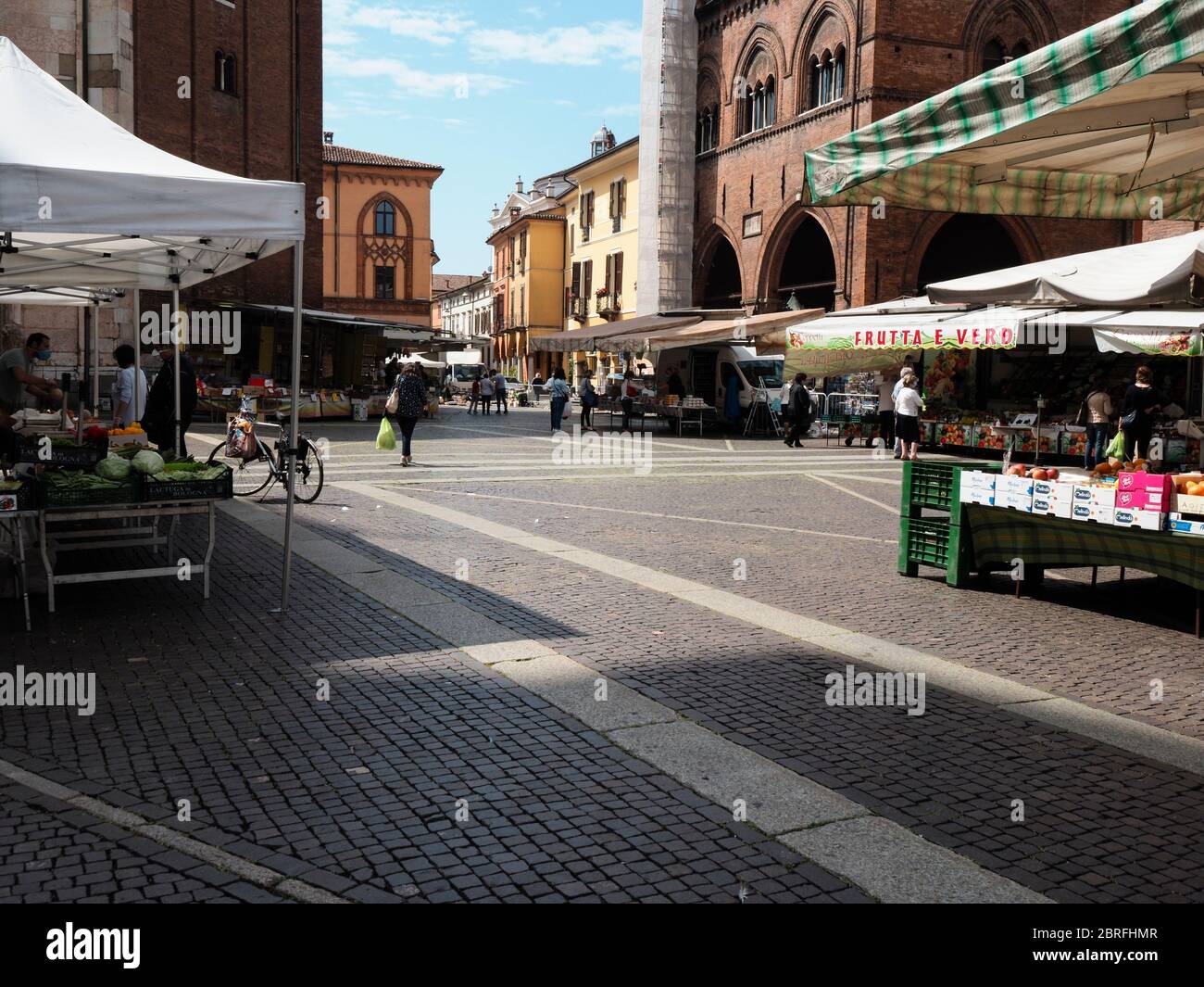 Cremona, Italy People grocery shopping in open air food market with
