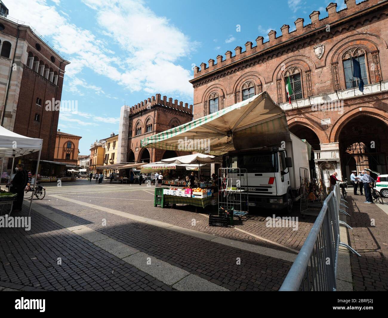 Cremona, Italy People grocery shopping in open air food market with