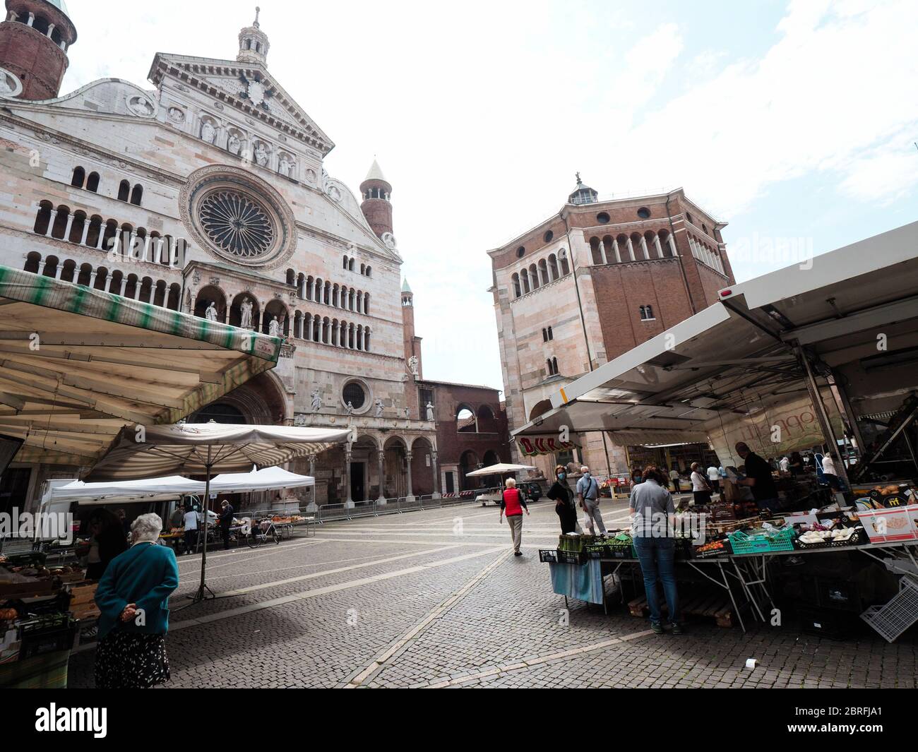 Cremona, Italy People grocery shopping in open air food market with