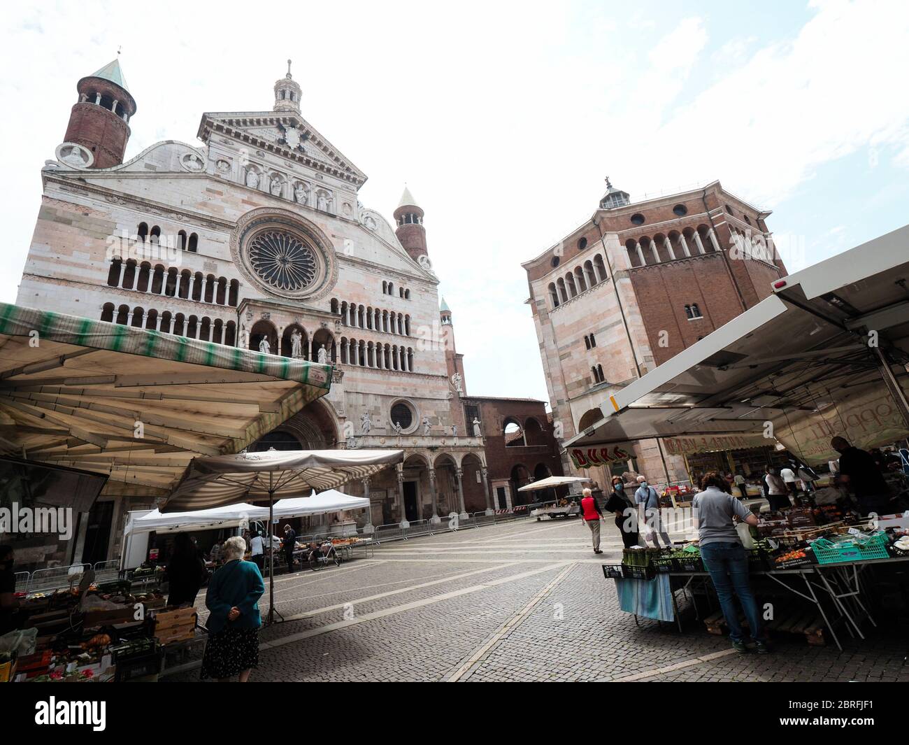 Cremona, Italy People grocery shopping in open air food market with
