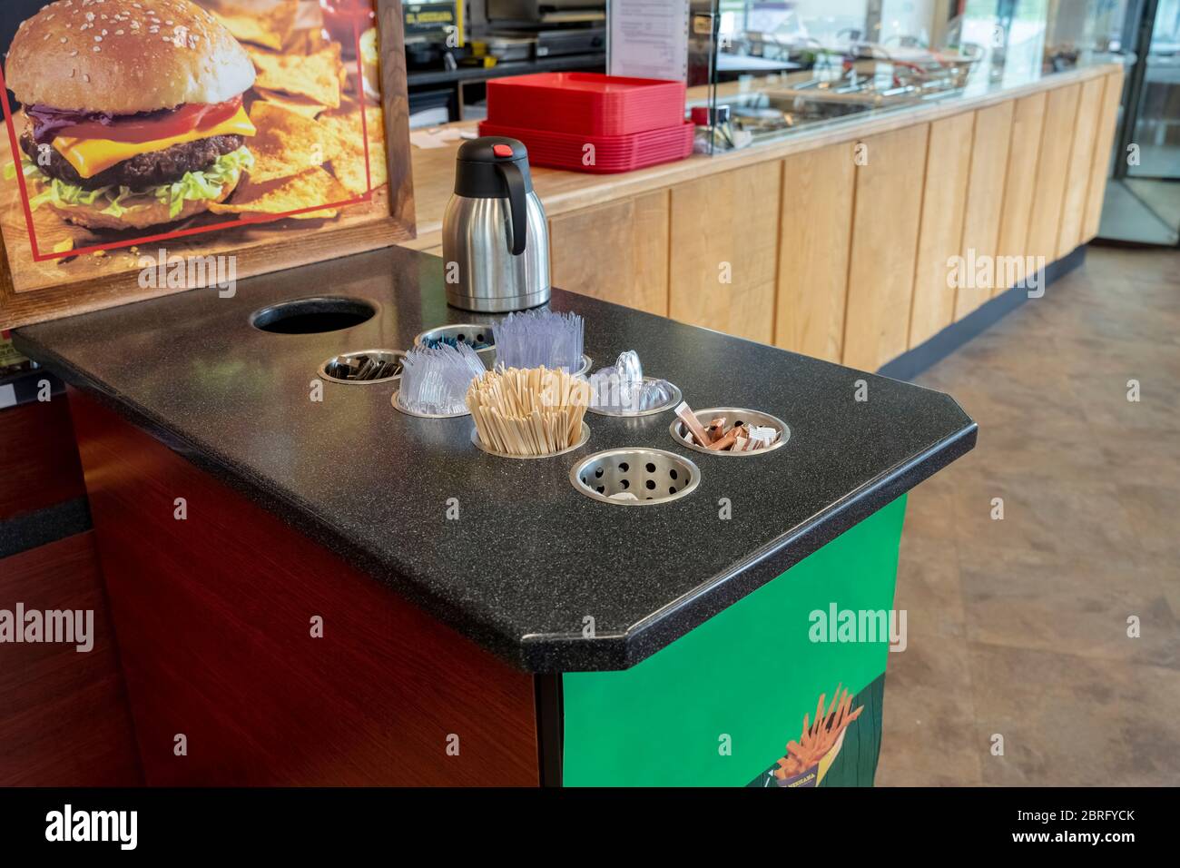 Closeup view of various disposable wooden sticks, plastic utensils, spices, tooth sticks and