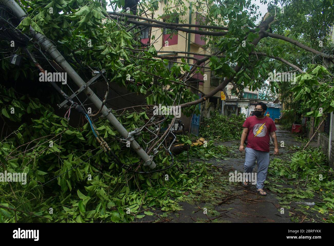 Kolkata, India. 21st May, 2020. Everywhere in the city, today one can see the massive destruction caused by super cyclone Amphan, last evening this massive cyclone destroyed the city. Tress uprooted, signal posts are broken, many rooftops of houses are flown in the winds and huge area of city were suffering from electricity. Still now 10-12 casualties reported and amount of total losses of property are presently being estimated by the State Government. (Photo by Anirban Lahiri/Pacific Press) Credit: Pacific Press Agency/Alamy Live News Stock Photo