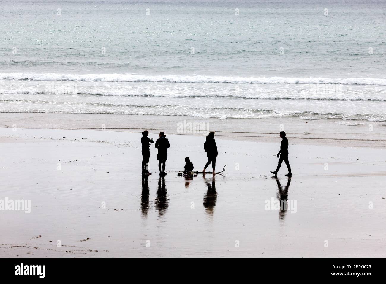 Garrettstown, Cork, Ireland. 21st May, 2020. A group taking advantage of the lifting of some Covid-19 restrictions to visit the beach at Garrettstown, Co. Cork, Ireland. - Credit; David Creedon / Alamy Live News Stock Photo