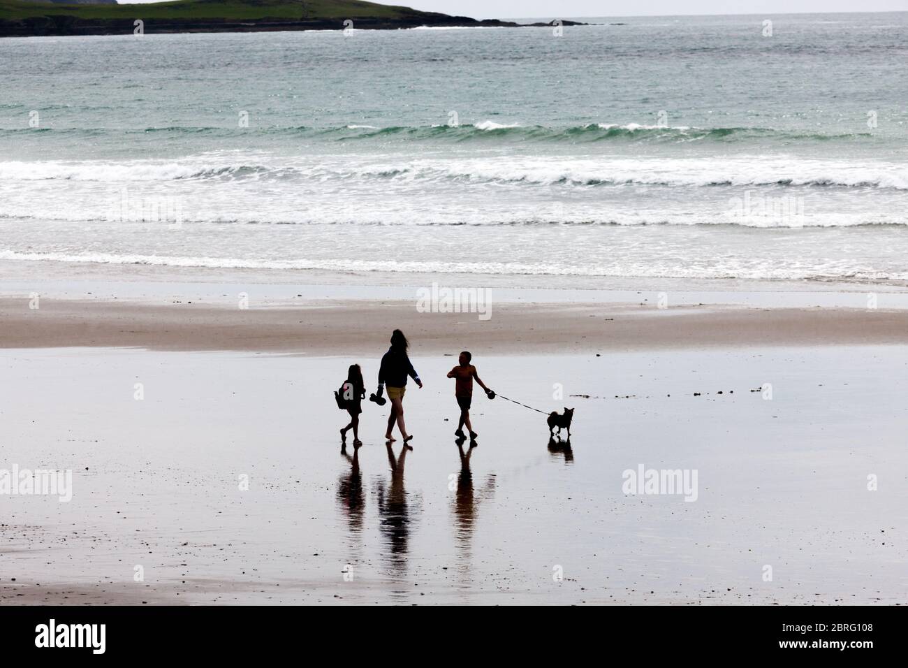 Garrettstown, Cork, Ireland. 21st May, 2020. A group taking advantage of the lifting of some Covid-19 restrictions to visit the beach at Garrettstown, Co. Cork, Ireland. - Credit; David Creedon / Alamy Live News Stock Photo