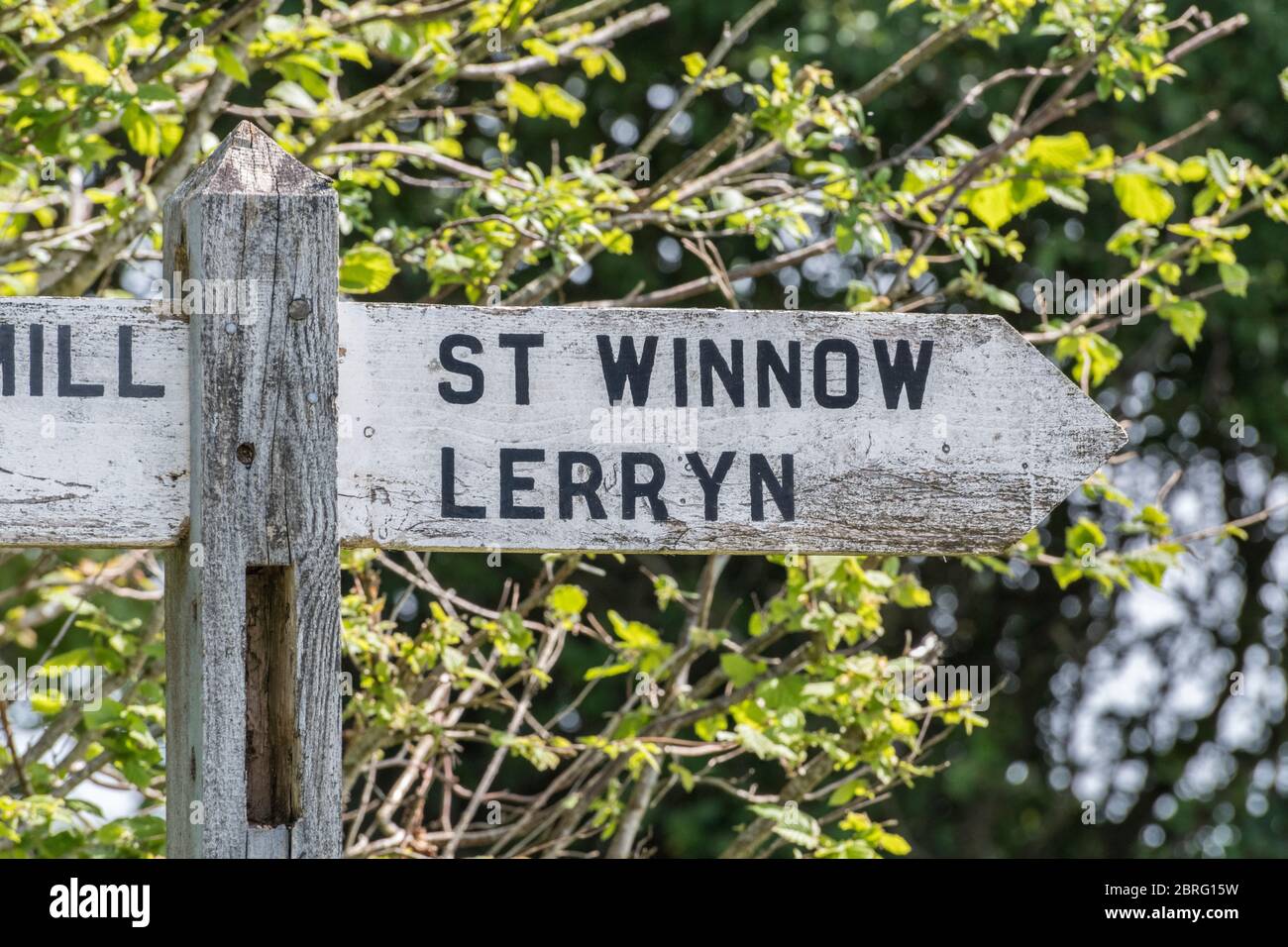 Local rural road direction sign to the Cornish village of Lerryn and hamlet of St. Winnow. Metaphor mid-Cornwall country life, Cornwall tourism. Stock Photo