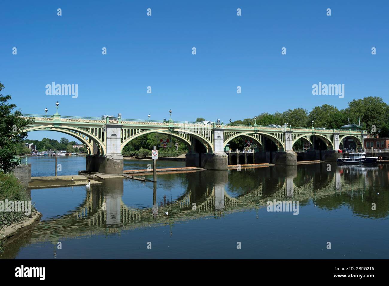 richmond lock footbridge reflected in the thames as it spans the river between richmond and twickenham, southwest london, england Stock Photo