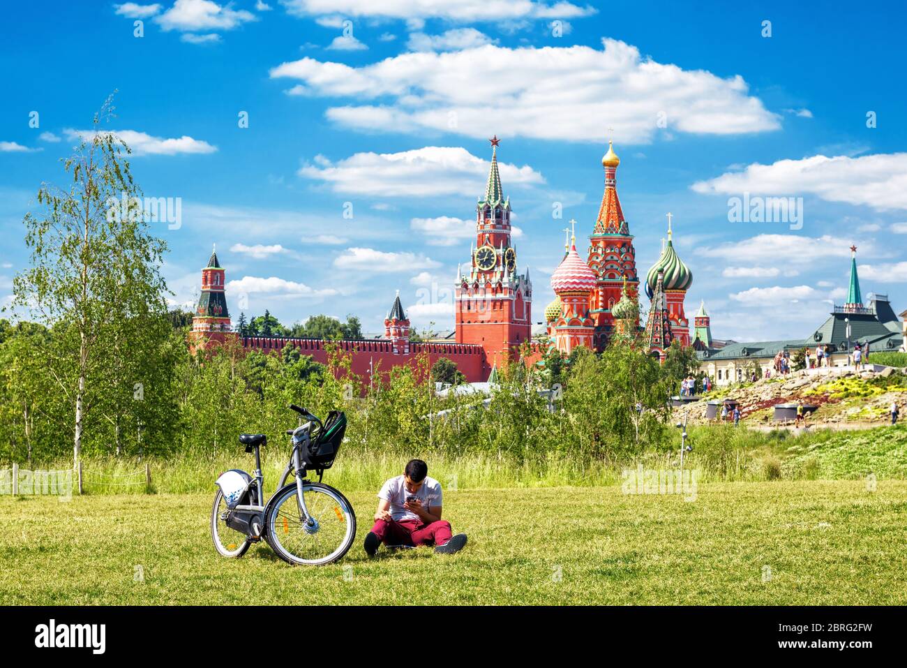 Moscow - June 17, 2018: People relax in Zaryadye Park near Moscow Kremlin, Russia. Scenic view of the Moscow centre on a sunny summer day. Kremlin is Stock Photo