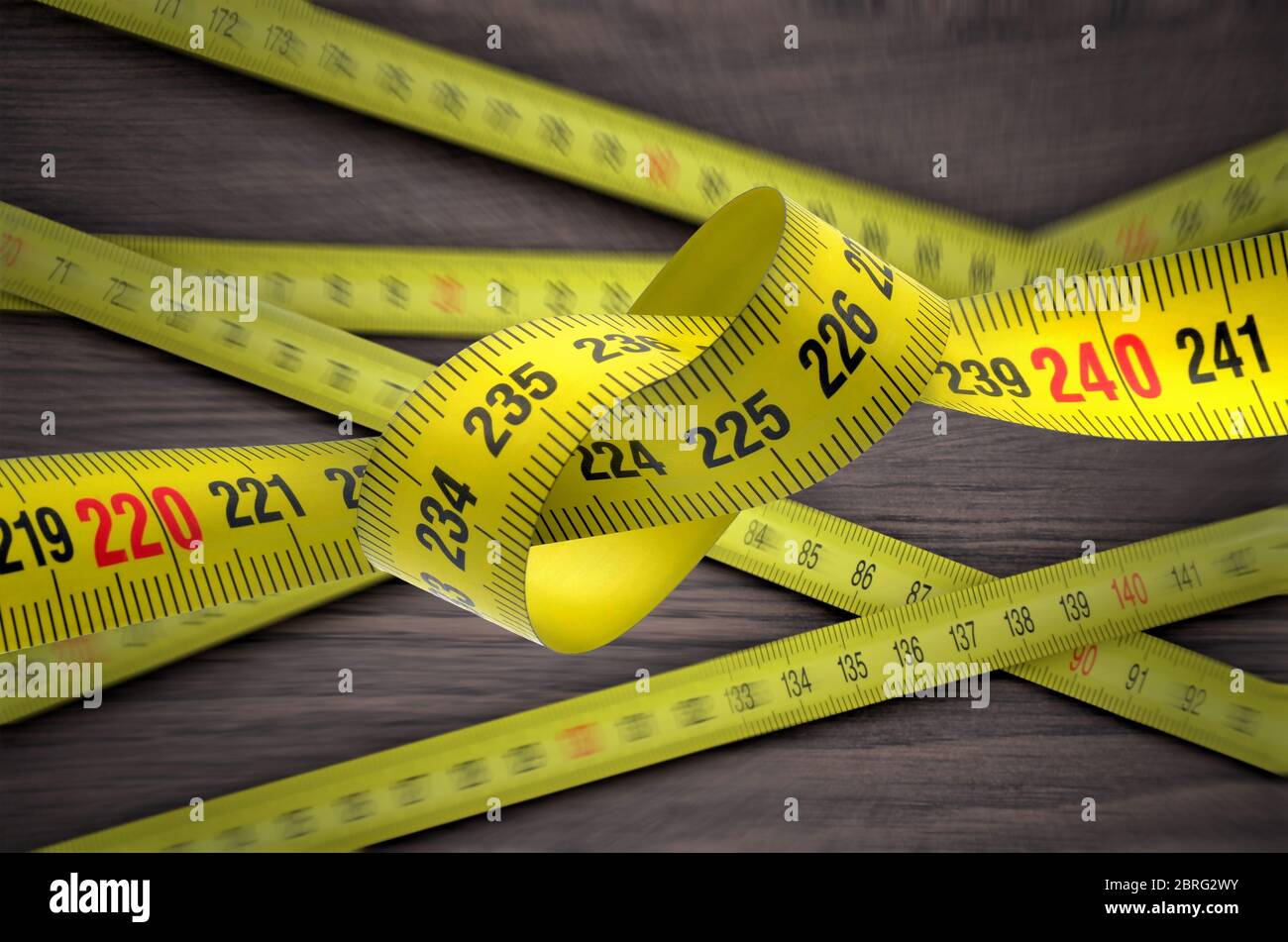 tangled yellow tape measure Stock Photo