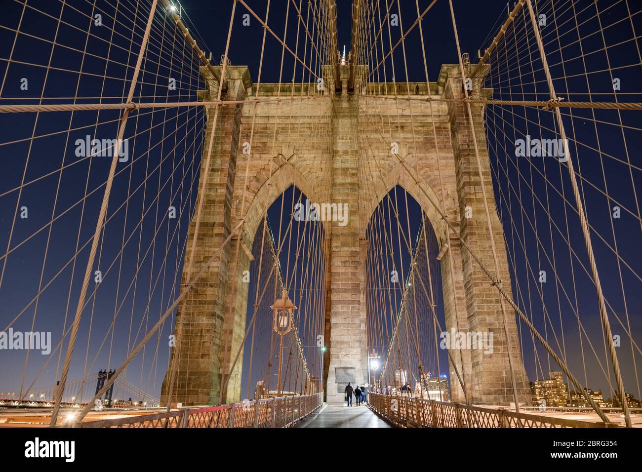 A long exposure of the arches of the Brooklyn Bridge at night, New York, USA Stock Photo