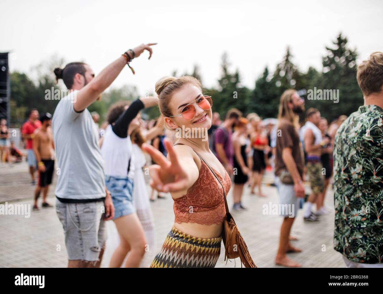 Beautiful young woman dancing at summer festival Stock Photo - Alamy