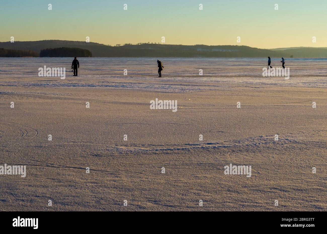 People walking on ice at frozen Lake Päijänne at Winter , Finland Stock Photo