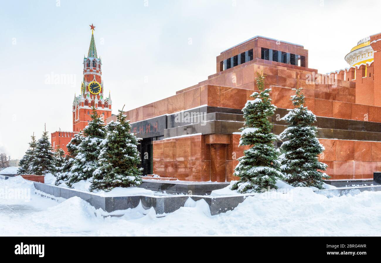 Moscow Red Square in winter, Russia. Lenin's Mausoleum by Moscow Kremlin under snow. This place is a famous tourist attraction of Moscow. The inscript Stock Photo