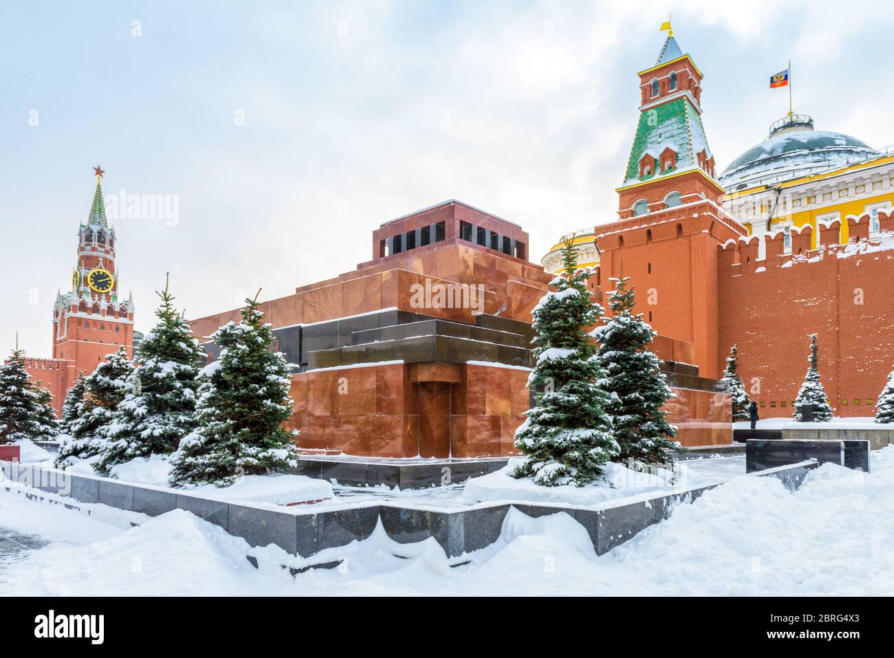 Moscow Red Square in winter, Russia. Lenin's Mausoleum by Moscow Kremlin under snow. This place is famous tourist attraction of Moscow city. Center of Stock Photo