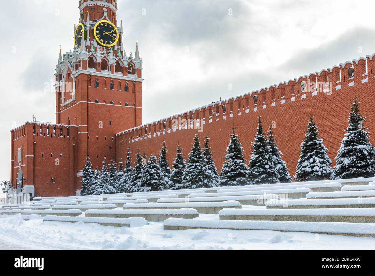 Moscow Kremlin with Spasskaya Tower on the Red Square during snowfall in winter, Moscow, Russia. The Red Square is the main tourist attraction of Mosc Stock Photo