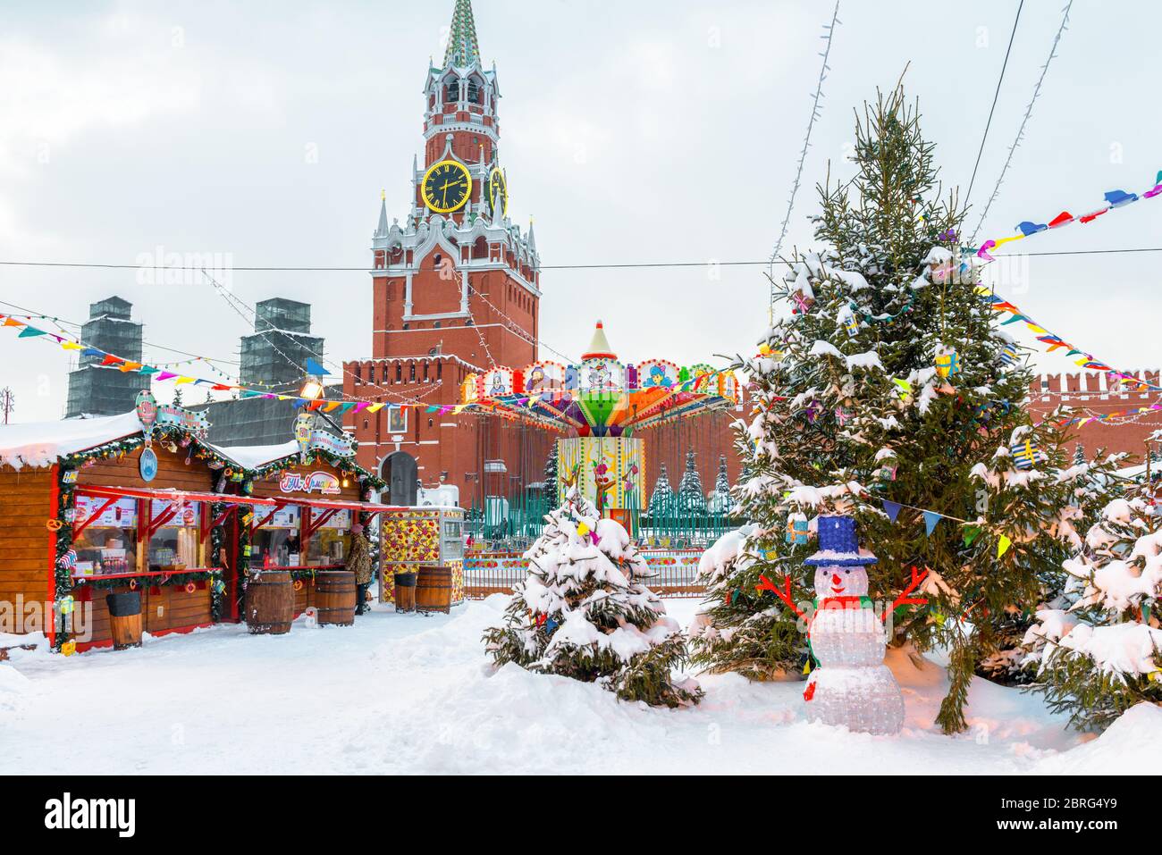 Moscow, Russia - Feb 5, 2018: Scenery of the festive Red Square in winter Moscow. Christmas decorations near the Moscow Kremlin during snowfall. New Y Stock Photo