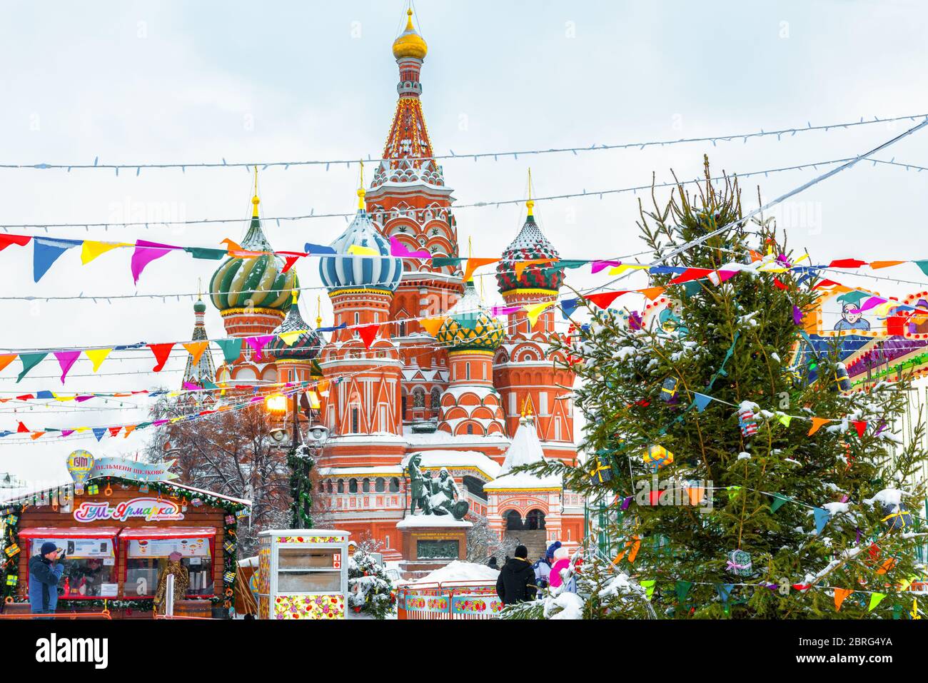 Moscow, Russia - Feb 5, 2018: Scenery of the festive Red Square in winter Moscow. Christmas decorations near the Moscow Kremlin during snowfall. New Y Stock Photo