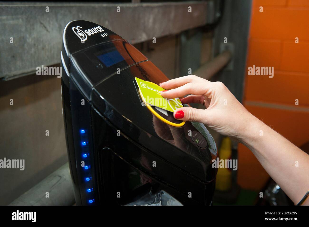 Using a Source East contactless smart card at an electric car charging point in the UK. Stock Photo