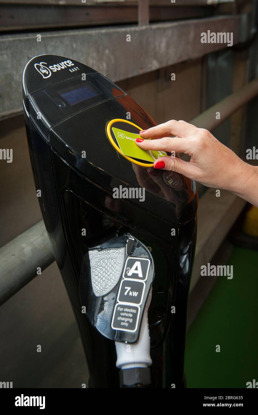 Using a Source East contactless smart card at an electric car charging point in the UK. Stock Photo