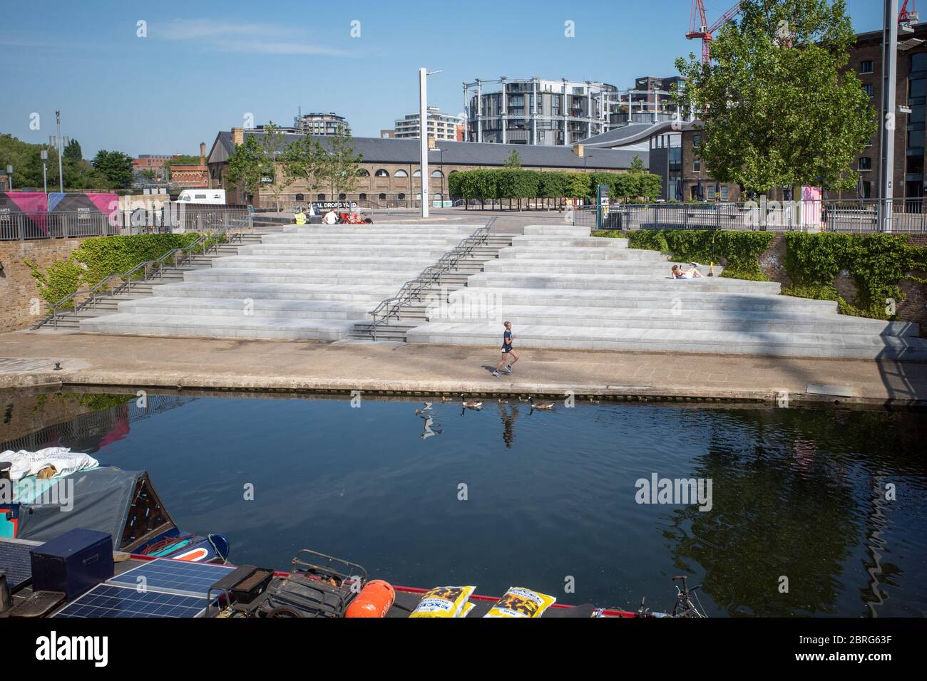 London: May 20th 2020, despite the good weather people avoid the normally popular steps from the Regents Canal at Granary Square during lockdown Stock Photo