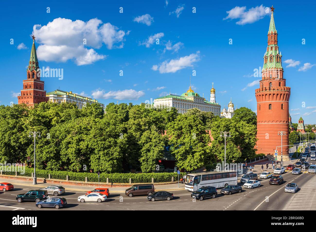 Moscow Kremlin and road traffic, Russia. Famous Moscow Kremlin is a top tourist attraction of city. Panorama of the Moscow center with embankment in s Stock Photo