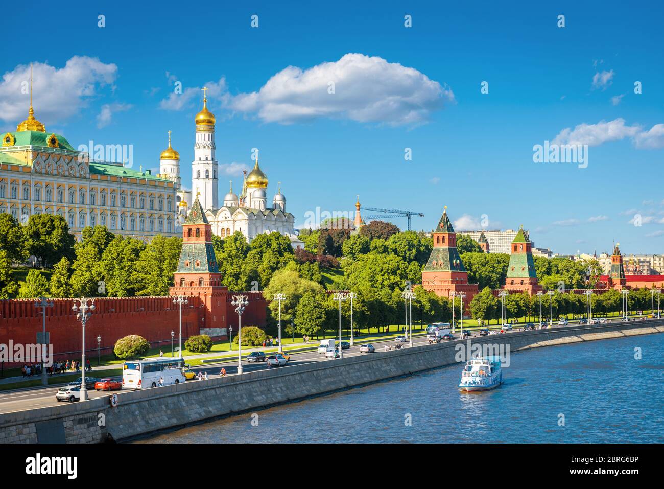Moscow Kremlin in summer, Russia. Famous Moscow Kremlin is a top tourist attraction of city. Scenic view of the old Moscow landmark on embankment of M Stock Photo